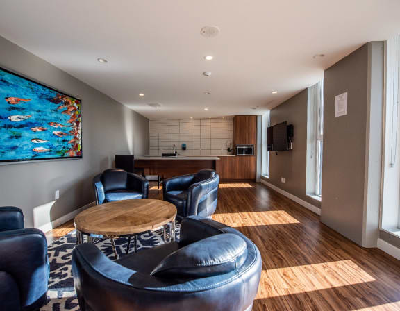 a living room with a table and chairs and a couch